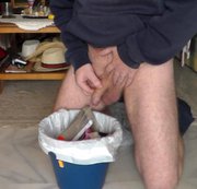 WorldOfJen – John is Peeing in all in the Trashcan